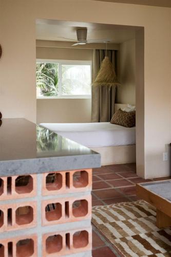 a bedroom with a bed in a room with a window at Sand Castle in Imperial Beach
