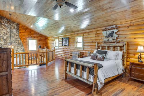 a bedroom with a bed in a log cabin at Rustic Retreat in Hickman on 160 Acres with Views! in Gordonsville