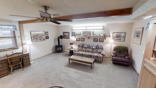 a living room with a couch and a table at Roberts Trappers Lodge - Pet Friendly - WiFi- Trailer Parking - Garage Access - Washer - Dryer - Great Views in Red River