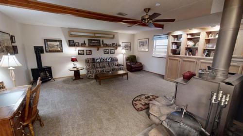 a living room with a couch and a ceiling fan at Roberts Trappers Lodge - Pet Friendly - WiFi- Trailer Parking - Garage Access - Washer - Dryer - Great Views in Red River