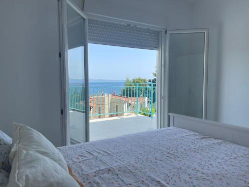 Giường trong phòng chung tại Villa DAMAKI