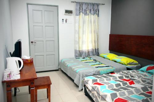 Cama o camas de una habitación en Niyaz Inn