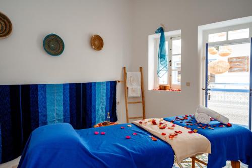 Ένα ή περισσότερα κρεβάτια σε δωμάτιο στο RIAD AMANA