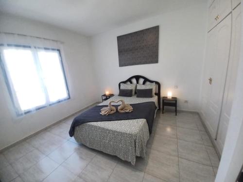 A bed or beds in a room at Relax playa blanca