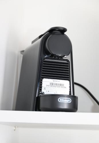 a cell phone sitting on top of a shelf at Caldera Suites "Φάρος" in Galissas