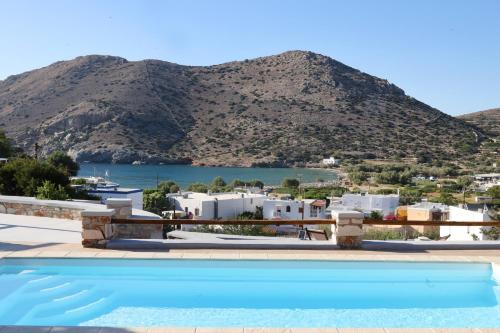 a pool with a view of a mountain at Caldera Suites "Φάρος" in Galissas