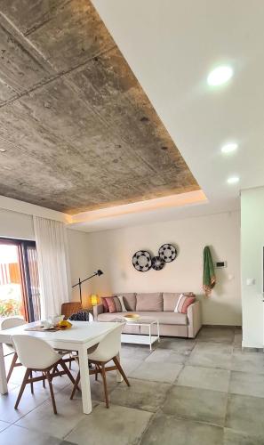 a living room with a couch and a table at Papaya Apartments Sal Island in Santa Maria