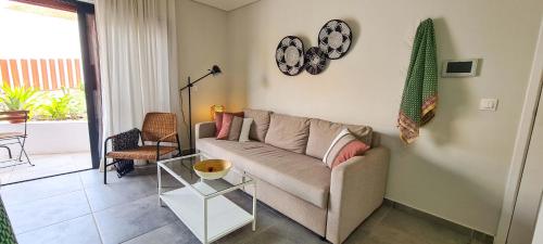 a living room with a couch and a table at Papaya Apartments Sal Island in Santa Maria