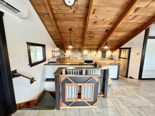 a room with a kitchen with a tub and a counter at Mountain Home Getaway-great VIEWS & exercise room in Pocatello