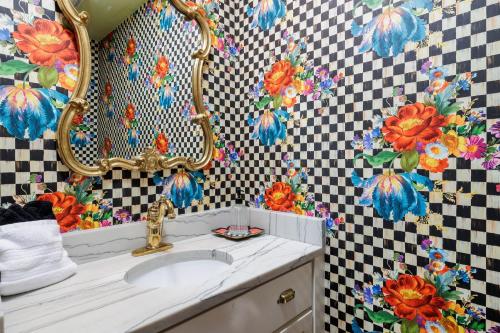 a bathroom with a sink and a mirror at Unique Victorian Estate Pets Welcome Pool BBQ Picnic Privacy in Dripping Springs