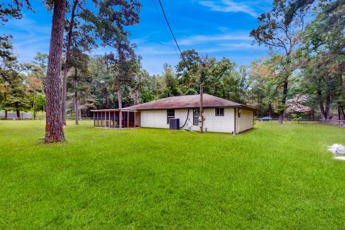 a small house in a yard with a tree at Porter Retreat in Porter