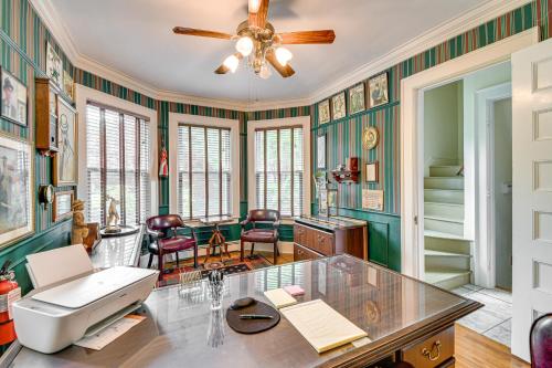a room with green walls and a ceiling fan at Geneva Vacation Rental with Vineyard and Lake Views! in Geneva