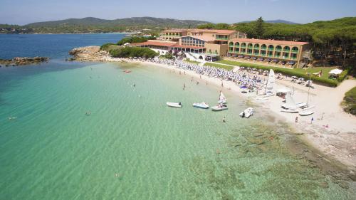 an aerial view of a beach with boats in the water at Hotel Dei Pini in Alghero