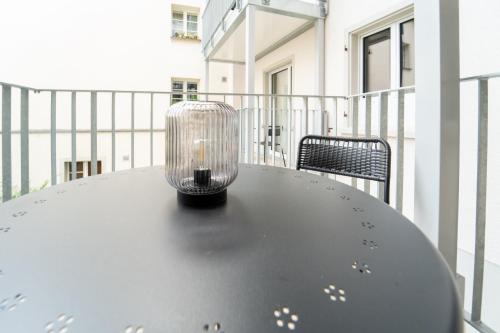 a candle sitting on top of a table on a balcony at Bezaubernde Wohnung im Kanton Zürich! in Winterthur