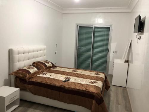 Ένα ή περισσότερα κρεβάτια σε δωμάτιο στο mohammédia -la siesta