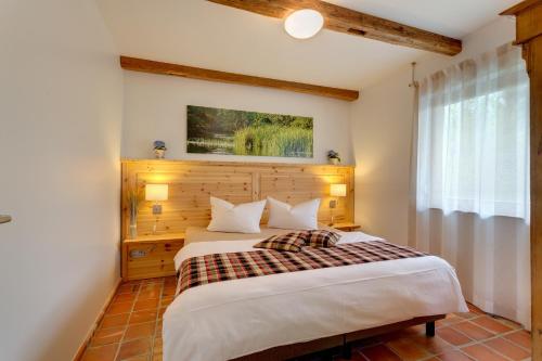 a bedroom with a large bed in a room at Spreewaldferienwohnungen in Lübben