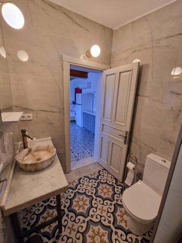 a bathroom with a sink and a toilet in it at Amos Sea View in Marmaris
