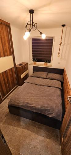 Katil atau katil-katil dalam bilik di Apartament Deluxe