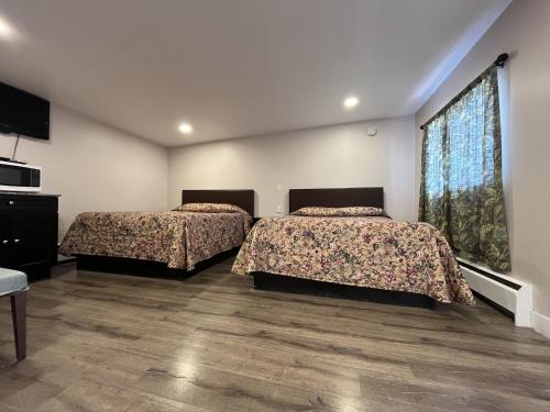 Ένα ή περισσότερα κρεβάτια σε δωμάτιο στο Kluane Park Inn