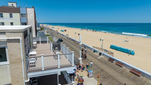 a view of a beach with a pier and the ocean at Safari Hotel Boardwalk in Ocean City