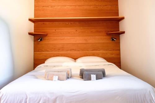 a bed with two towels on top of it at Marcassie Farm Lodges - Ash Studio in Forres