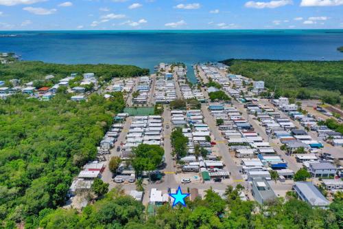 an aerial view of a parking lot next to the ocean at Paradise key largo in Key Largo