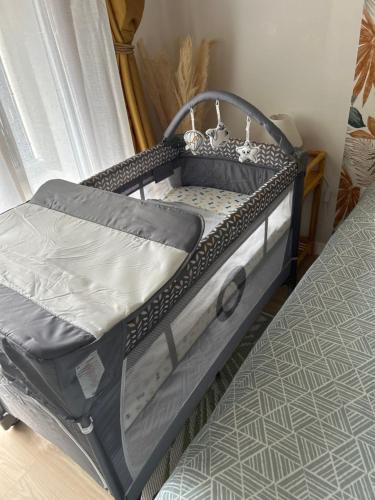 a small bed in a room with a mattress at Cosy Apartment - Parking, Garden,10mn from Disneyland! in Montévrain