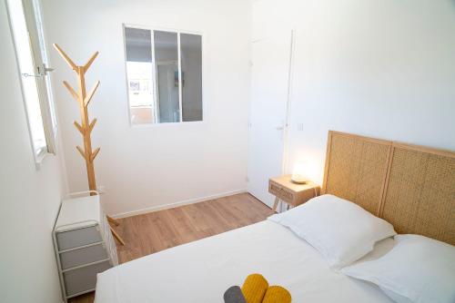 Кровать или кровати в номере T2 Les Dauphins Giens