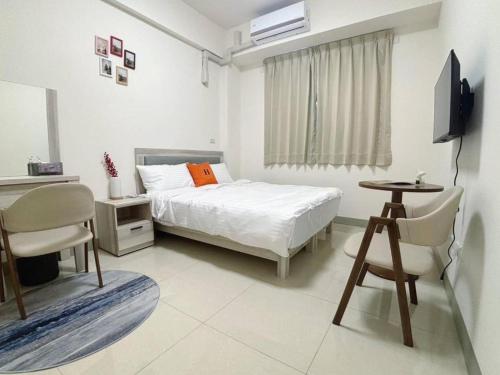 Postel nebo postele na pokoji v ubytování Ling Lai B&B