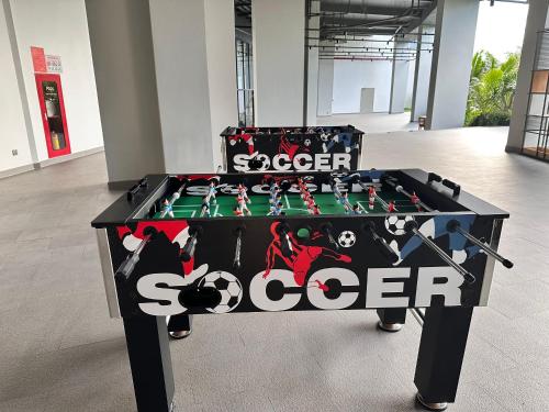 a foosball table with the word soccer on it at The Cam Ranh Beach Front in Cam Ranh