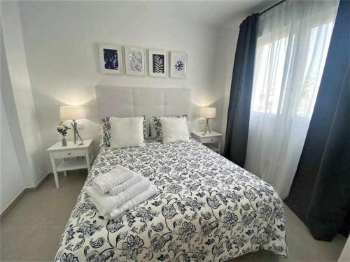 Postel nebo postele na pokoji v ubytování XIV Apartamentos Morales y Arnal