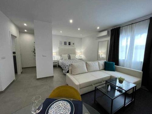 En eller flere senge i et værelse på XXI E Apartamentos Morales & Arnal