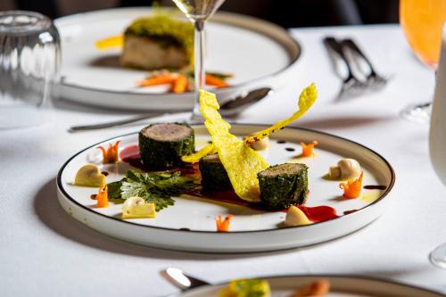 a plate of food sitting on a table at Escarpment Serengeti Luxury Camp in Serengeti