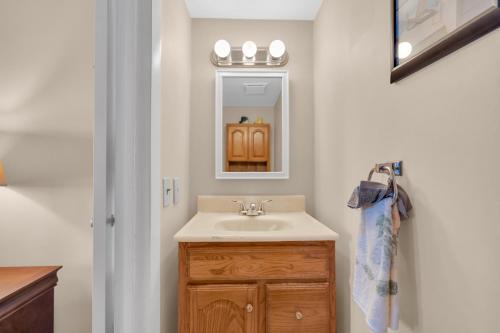 a bathroom with a sink and a mirror at Jersey Shore Getaway in Seaside Heights