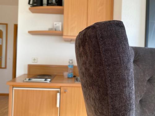 a close up of the back of a chair at Appartementhotel Röhrenbach in Immenstaad am Bodensee