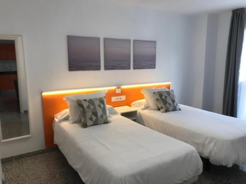 A bed or beds in a room at Bahia Colon
