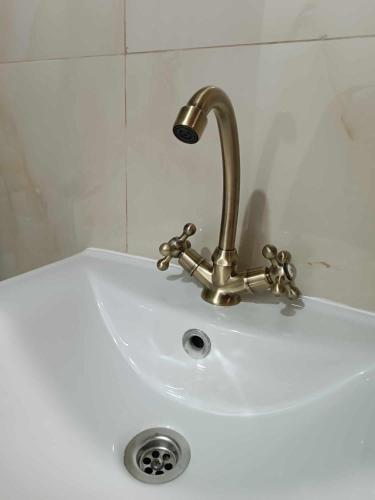 a sink with a faucet on top of it at Ascension Corfu Studios by GuestCorfu in Análipsis