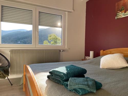 Postel nebo postele na pokoji v ubytování Au reposoir - vue sur la montagne