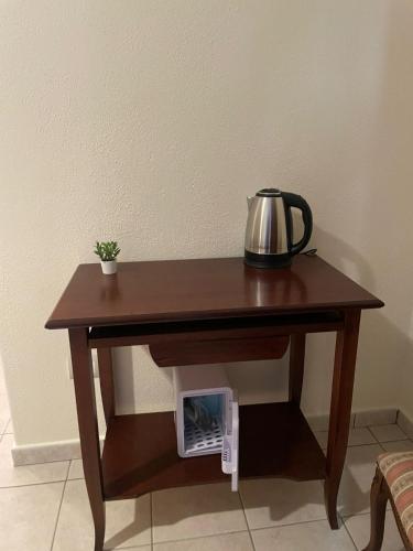 a table with a tea kettle on top of it at Palazzo 1815 in Papasidero