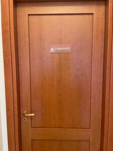 a wooden door with a sign on it at Palazzo 1815 in Papasidero