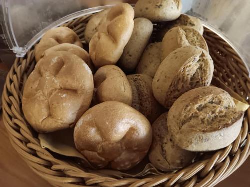 a basket filled with lots of different types of bread at ''Am Limes'' Hotel in Enns