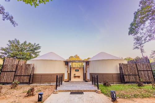 a building with two domes on top of it at Machaan Wilderness Lodge Nagarahole in Srimangala