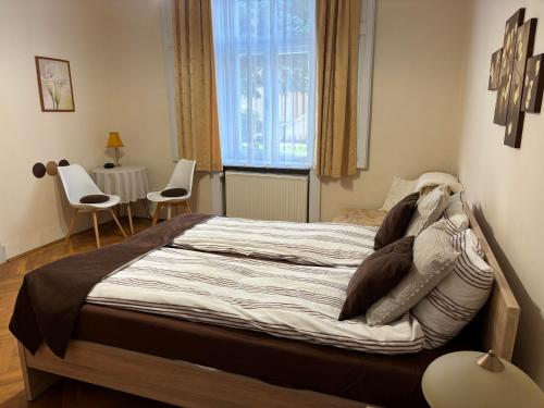 Posteľ alebo postele v izbe v ubytovaní Szalay Villa