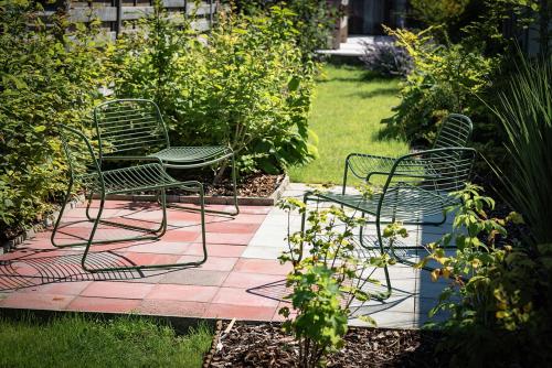a group of chairs sitting on a patio at ViaAmbioriX in Tongeren