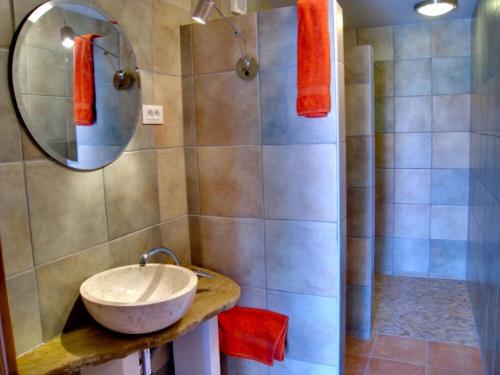 a bathroom with a sink and a shower with a mirror at Appartement Balthasar - Turm Krk in Sveti Vid-Miholjice