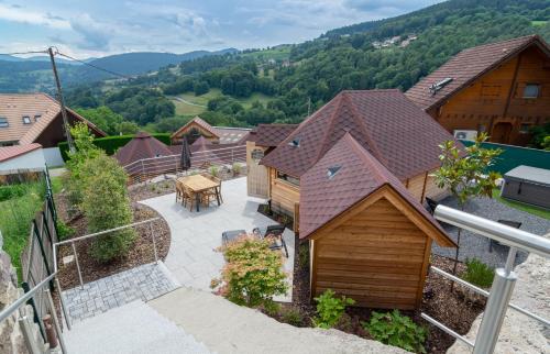 an overhead view of a house with a patio at Les Kotas du bonheur in Soultzeren