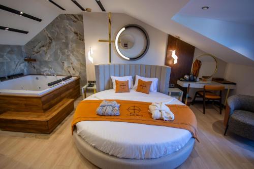 Una cama o camas en una habitación de Elysian Airport Hotel