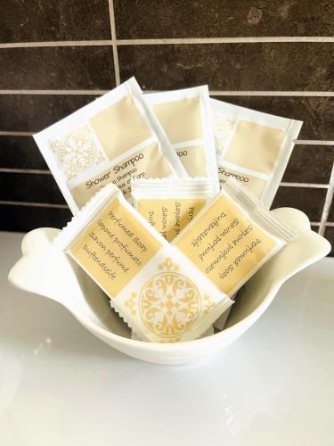 a white bowl filled with different types of books at Villa Adriana Hotel in Tivoli