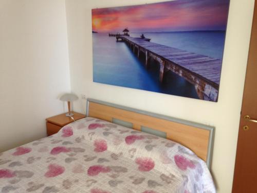 En eller flere senge i et værelse på La Quiete Anna Apartment