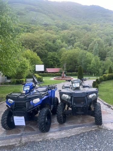 two atvs and two atvs parked next to each other at Golden Gate Resort in Agveran